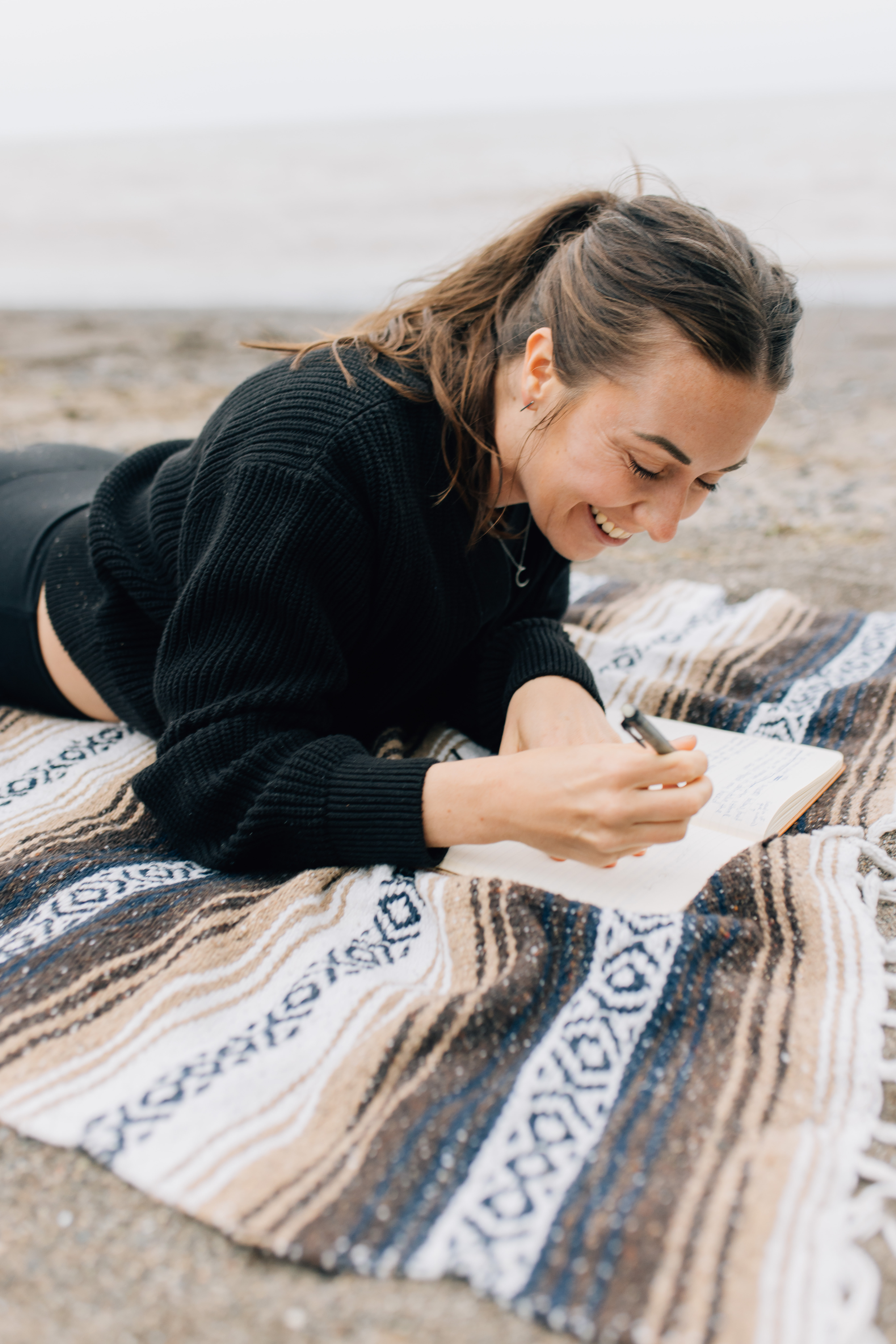 Emily Branton executive coaching journalling on the beach